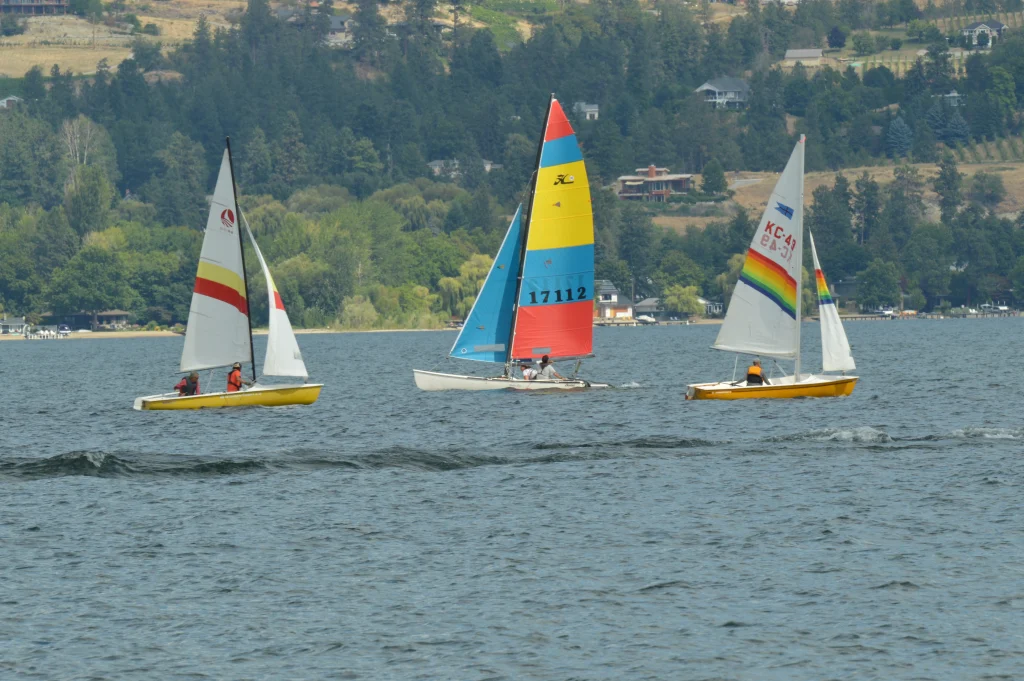 Catamaran caught between two monohulls